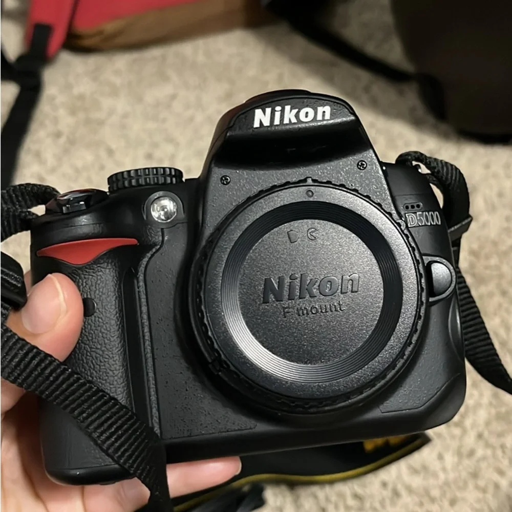 Nikon D5000 DSLR Camera with 18-22 mm lens & 1 battery, bag, and more